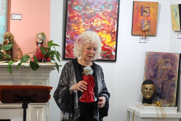 Mary Elizabeth Atwood showing her archetype figures.