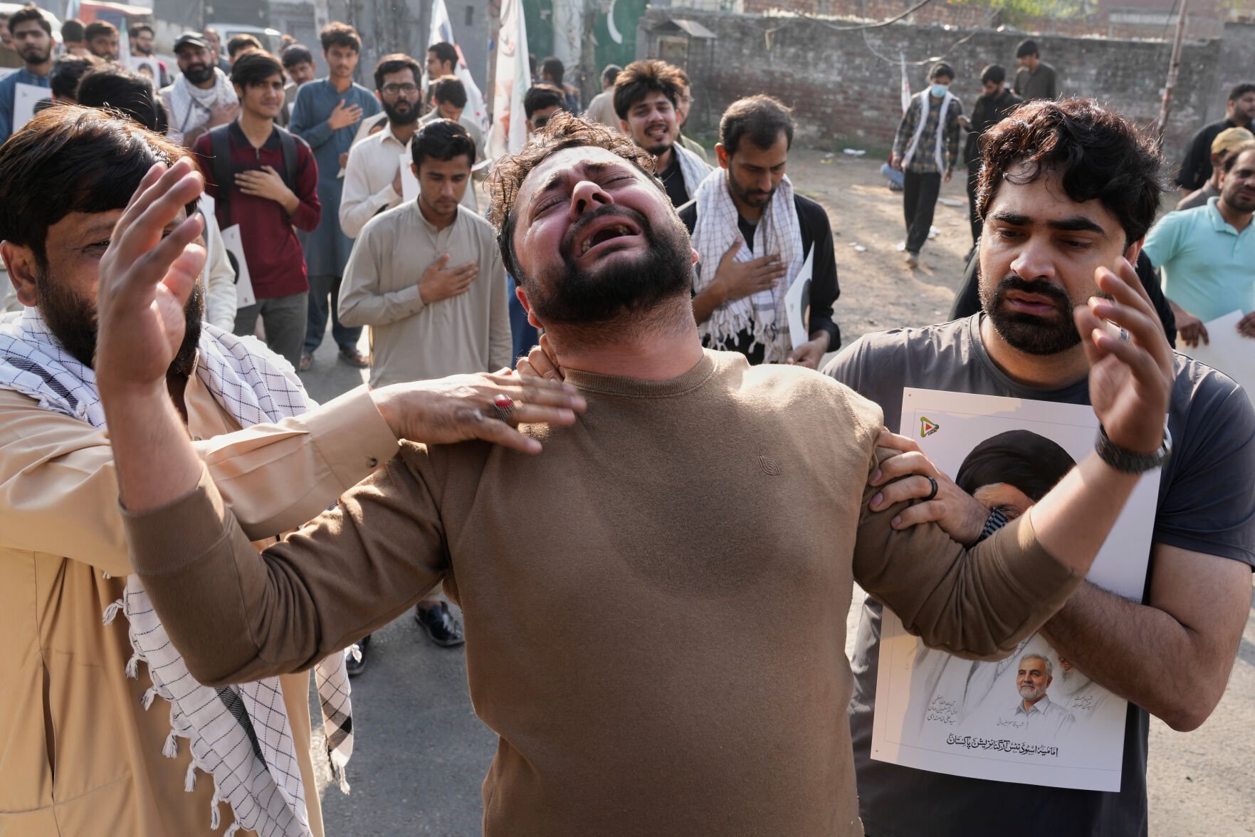 An overhead view of a street in Pakistan during an event, underscoring the importance of vigilance after the US Consulate Peshawar's decision.