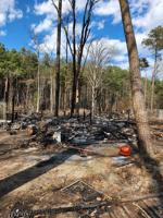Hurlock shed fire burns two acres of woods