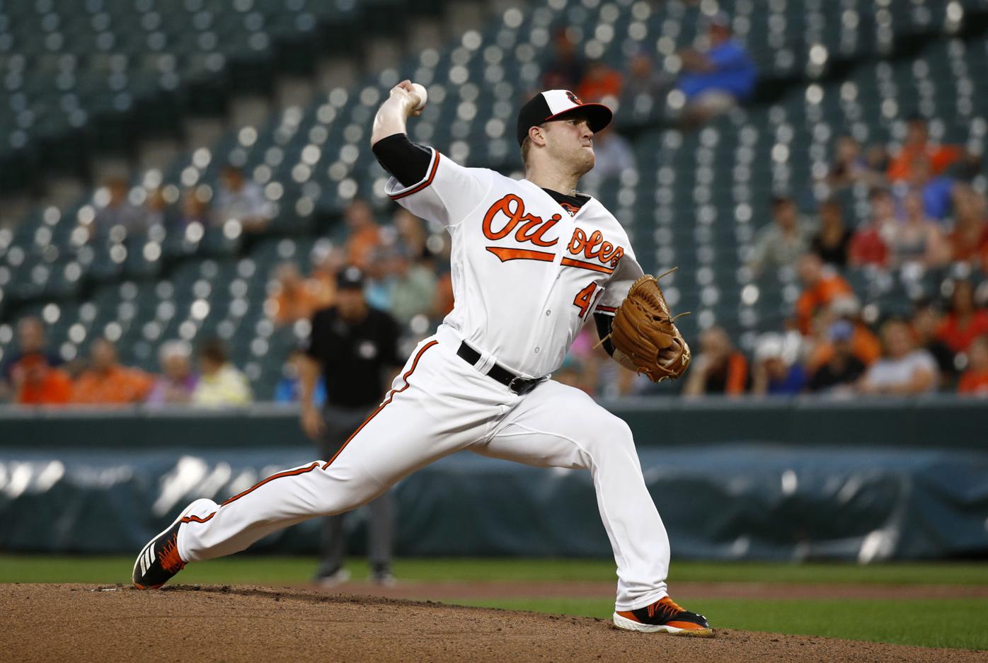 Baltimore Orioles starting pitcher Adam Eaton throws to a Chicago