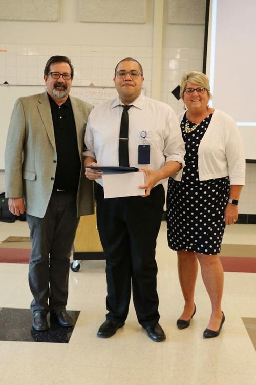 Holmes earns doctorate in educational research