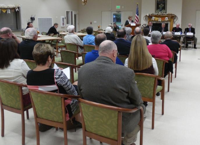 QA's public hears pros, cons of voting change Local