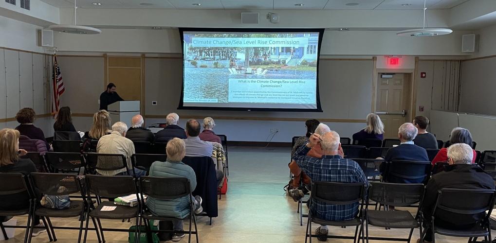 Citizens listen to a presentation about shoreline data collection app My Coast