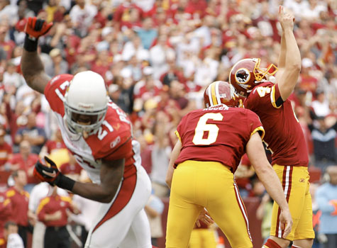 Tim Hightower of the Arizona Cardinal carries the ball against the