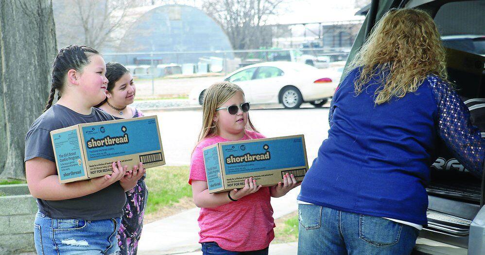 Girl Scouts donate 56 boxes of shortbread cookies to Gering Senior Center