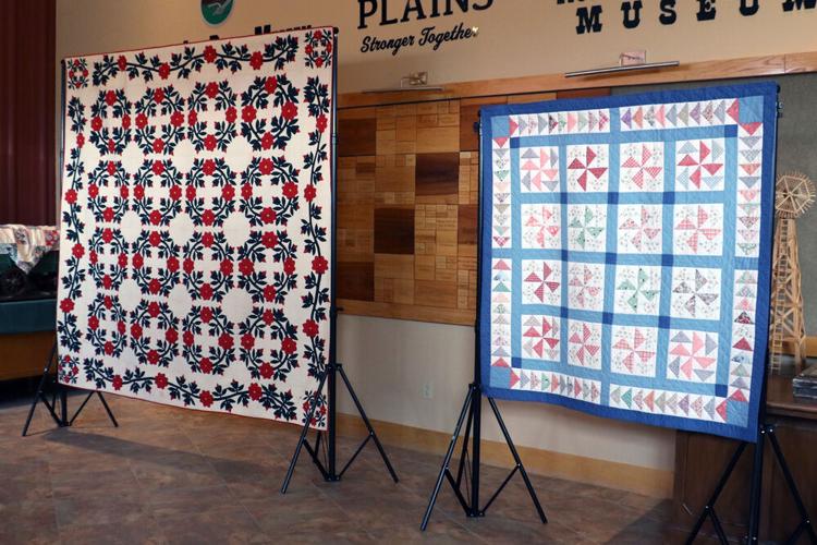 Local and international quilts displayed for an evening of quilt history