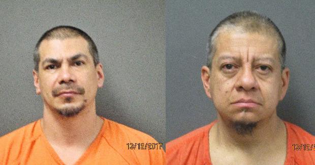 Two men accused of holding woman against her will over money