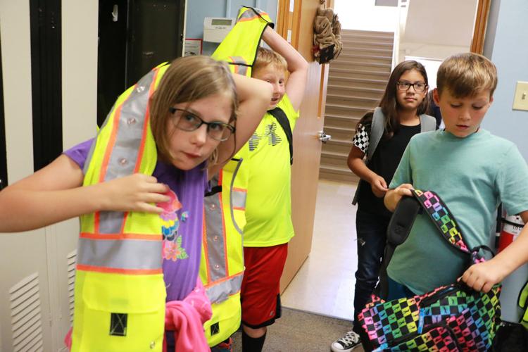 Lincoln Heights fifthgraders help students cross streets safely