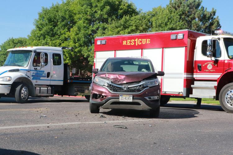 Woman transported to hospital after collision