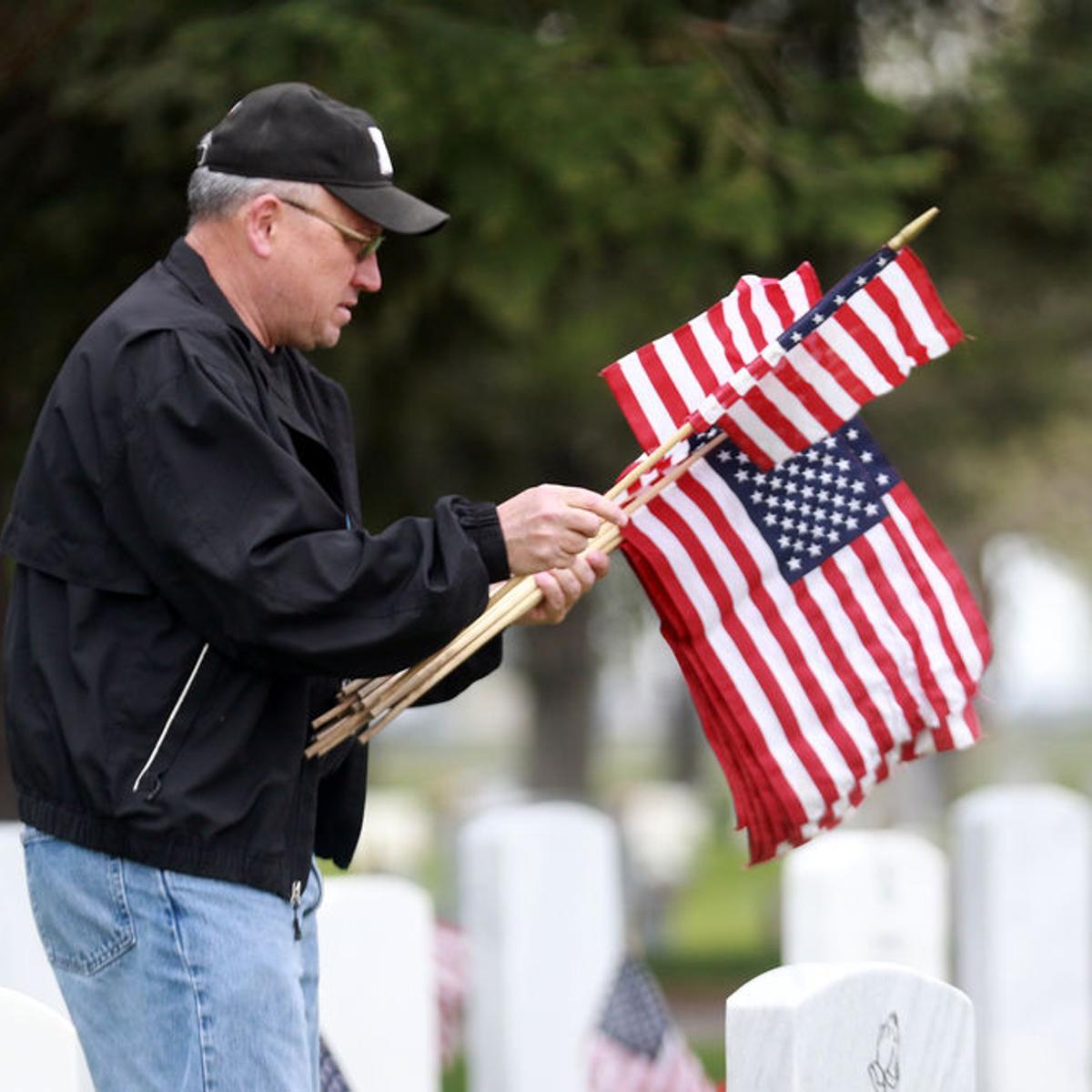 Volunteers Decorate Military Graves For Memorial Day Local News