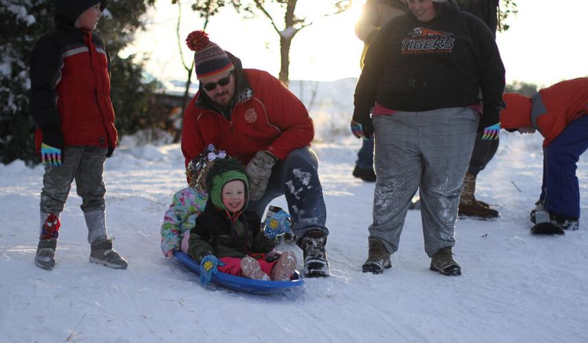 Taking a ride down the sledding hill