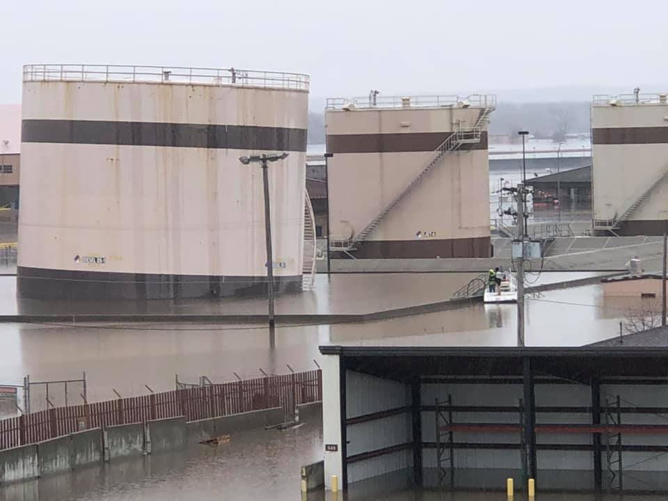 Offutt deploys containment boom around fuel tanks in flooded part of