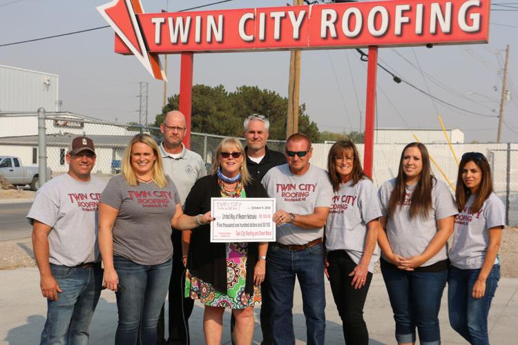 Twin City Roofing donates $52,500 to United Way