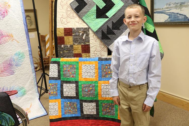 Local and international quilts displayed for an evening of quilt history