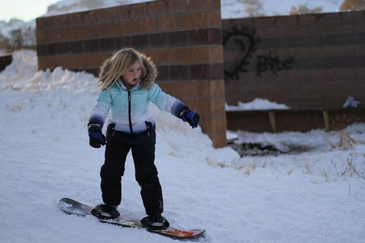 Taking a ride down the sledding hill