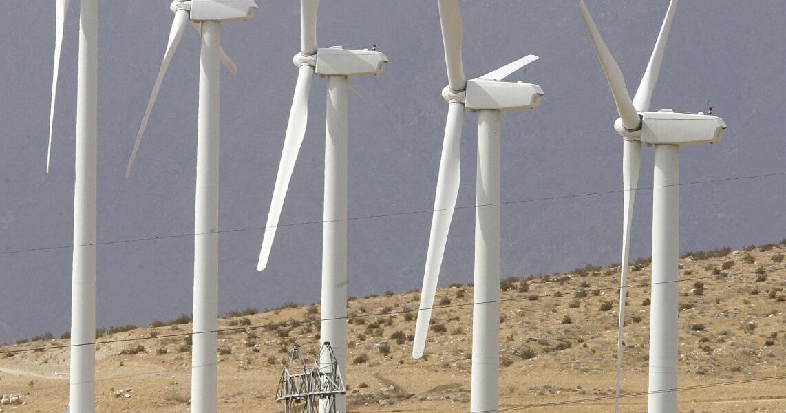 New larger windmills overlook a home near the intersection of Dillon Road and Highway 62 on July 26, 2006. More windmills may be