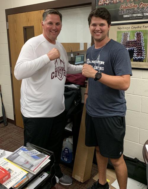 Heritage head football coach Kenneth Gilchrist (left) and his son, Brett Gilchrist (right)