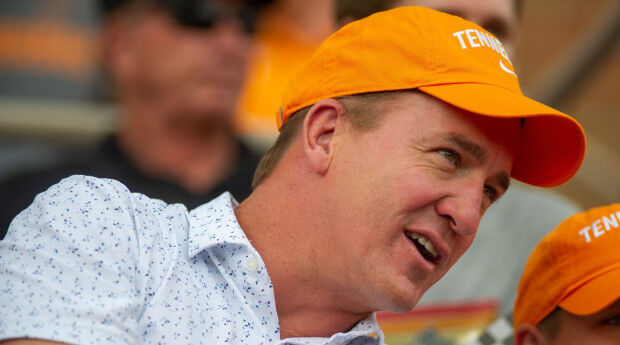 Peyton Manning & Eli Manning wear their new big hats on the ManningCast