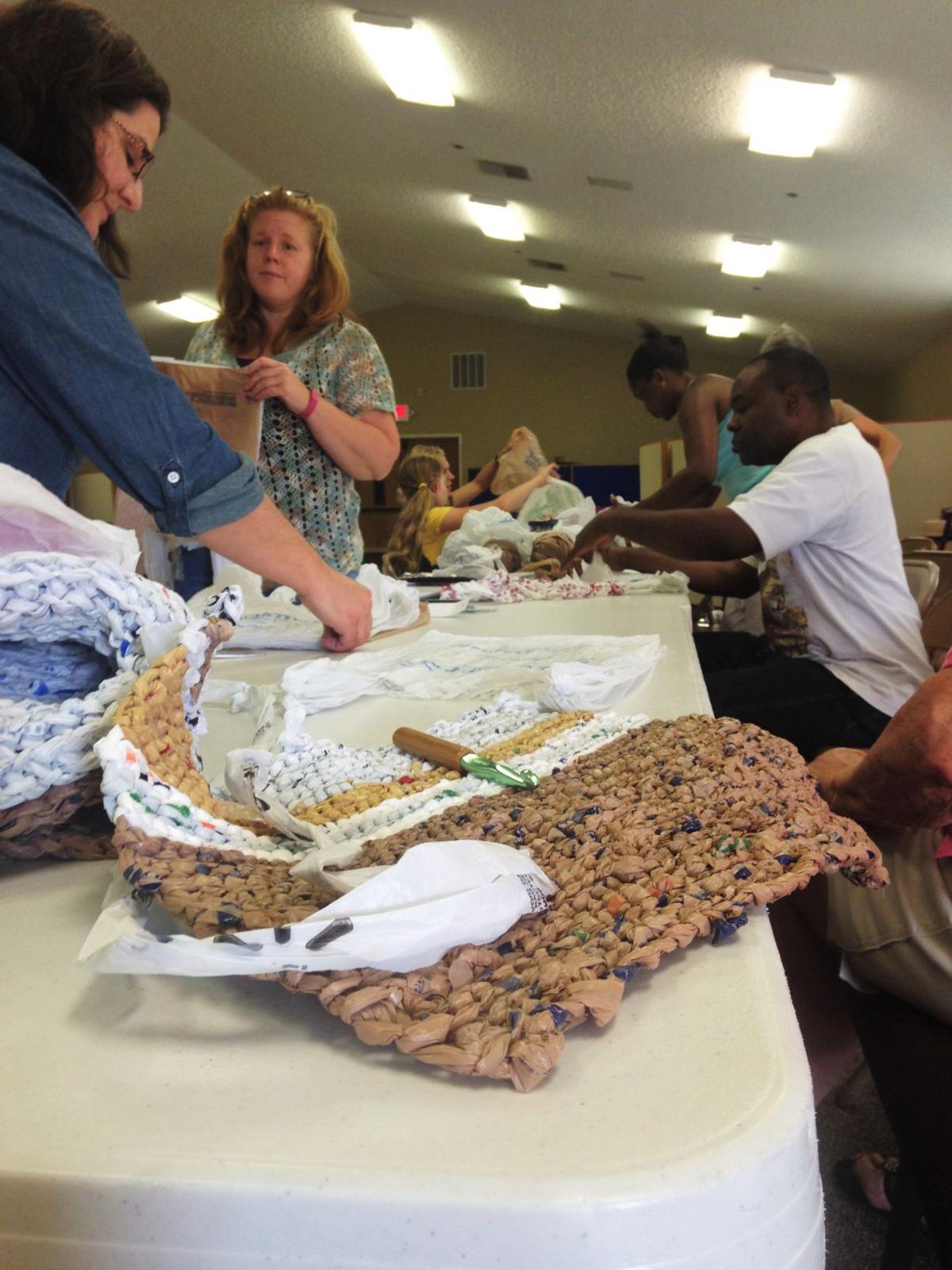 Weaving the community together Plano group makes mats for area homeless Plano Star Courier