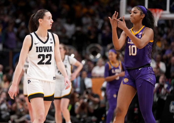 angel-reese-10-shows-iowa-caitlin-clark-her-ring-finger-during-the-final-seconds-of-the-womens-2023-ncaa-tournament-national-championship-game--