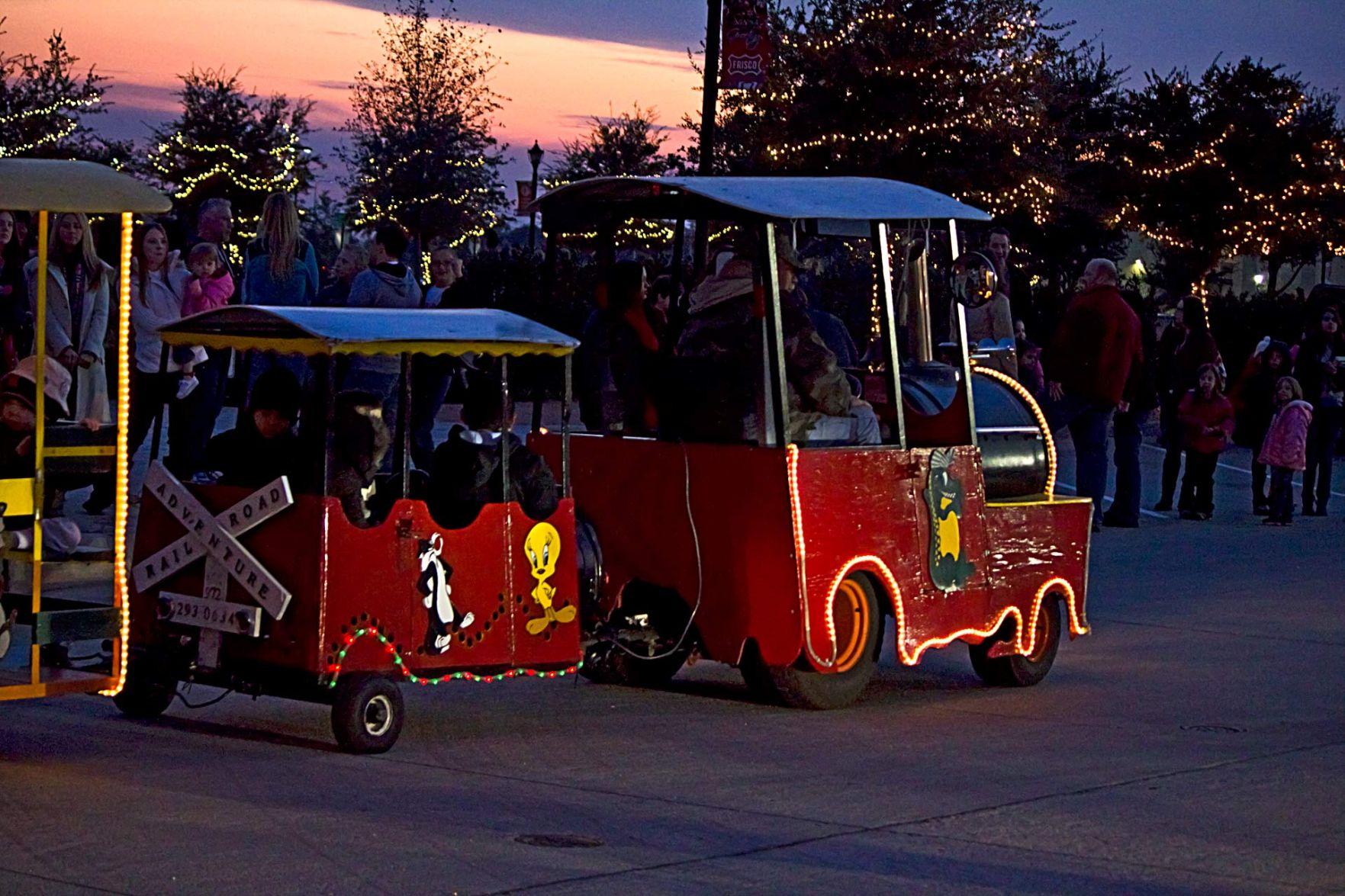 Enjoy the lights by a trackless train during Frisco's Christmas in the