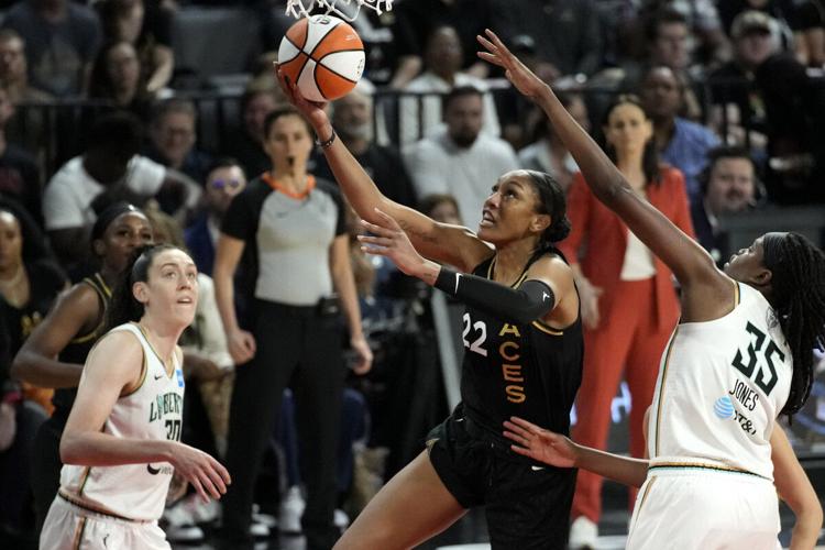 Forward A'ja Wilson reacts with teammate Forward Candace Parker of