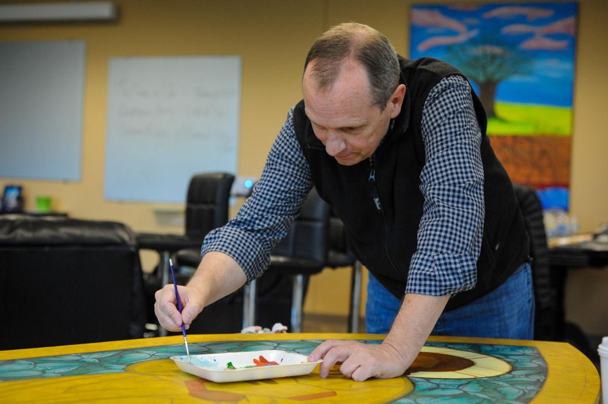 The Rev. Peter Pearson prayerfully paints icon for Frisco
