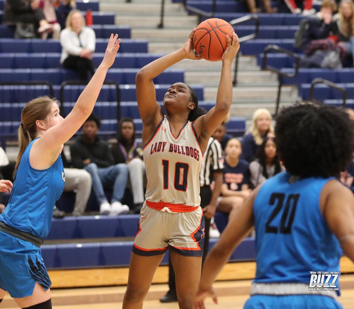 North sweeps Rock Hill: Lady Bulldogs make it 22 in a row; North boys avenge prior loss