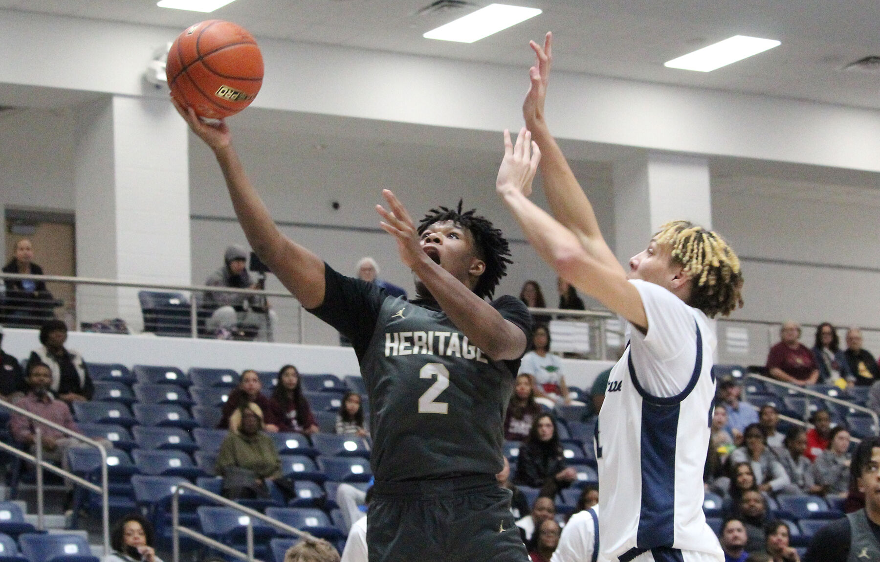 Heritage takes sole possession of first place in 10-5A with a 63-59 road win