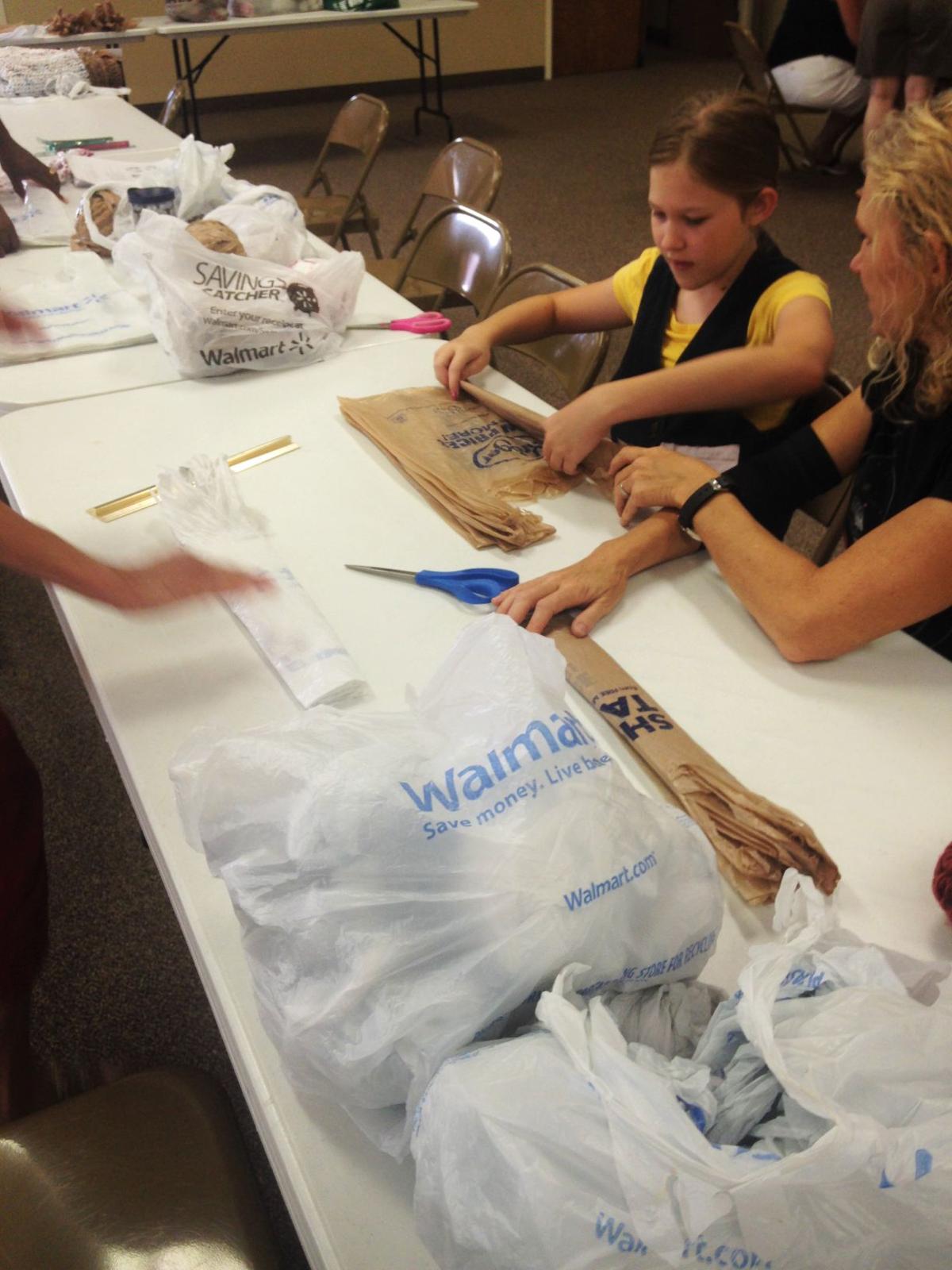 Weaving the community together Plano group makes mats for area