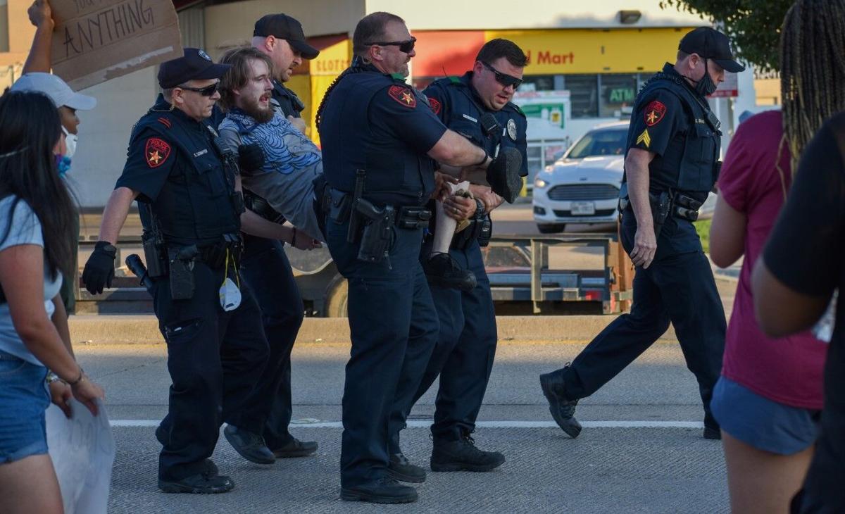 Tear gas used, 9 arrested at Lewisville protest News