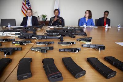 Ghost guns on display in front of AG Campbell and her deputies