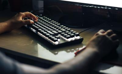 Man on computer keyboard