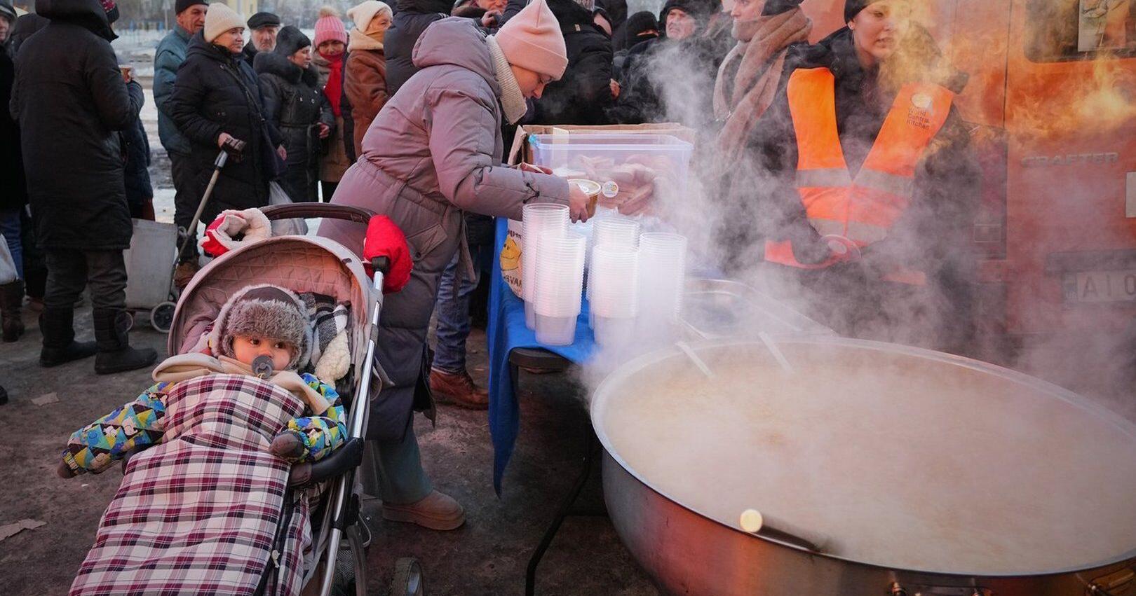In the Ukrainian capital , a mother struggles to keep her children warm and fed amid power outages