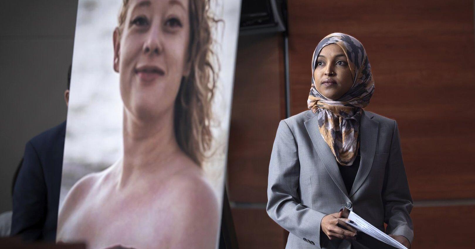 Man sprays unknown substance on Rep . Ilhan Omar and is tackled at Minneapolis town hall