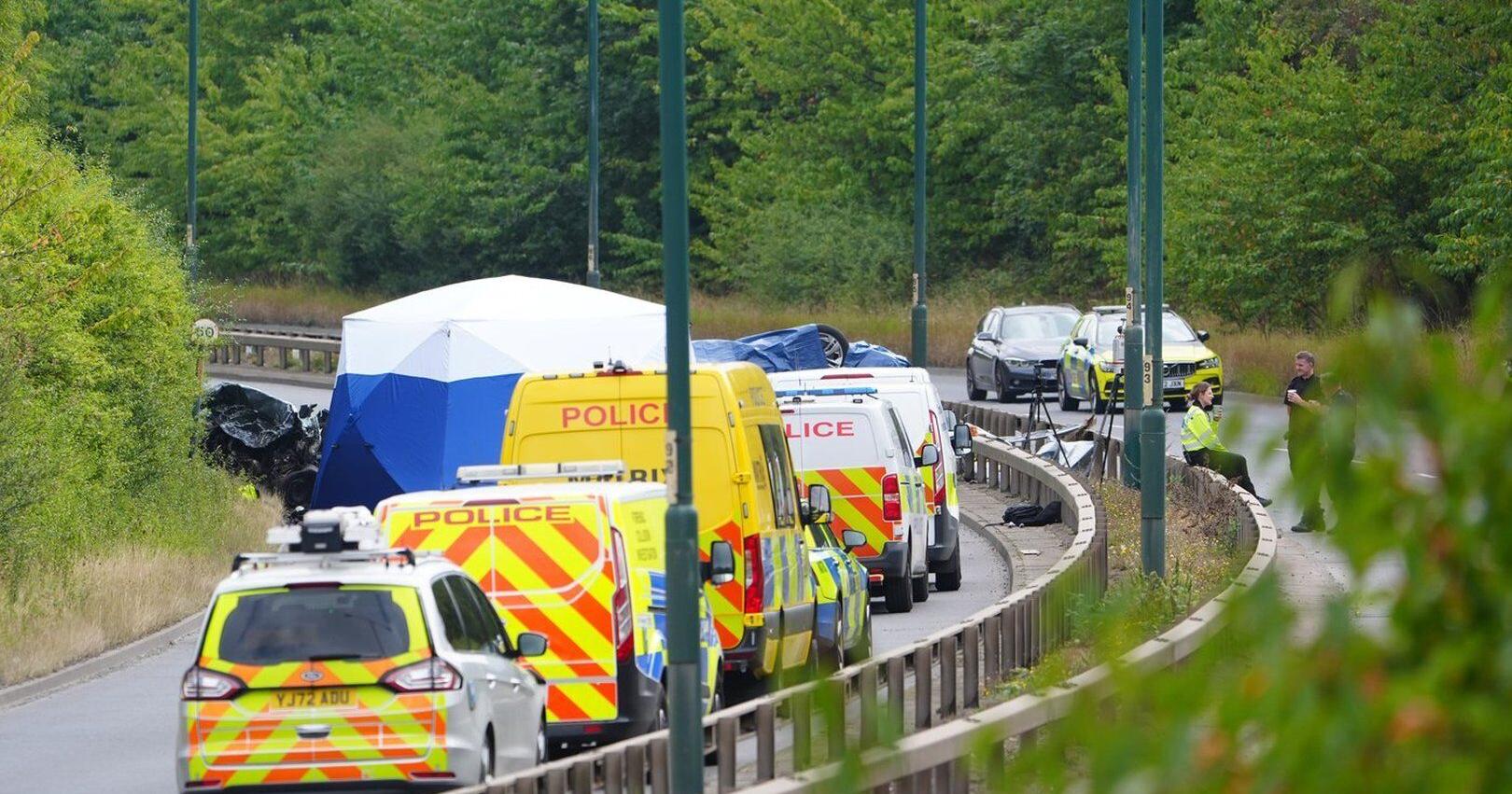 7 people , including 2 police officers , die following a head - on collision in northeast England