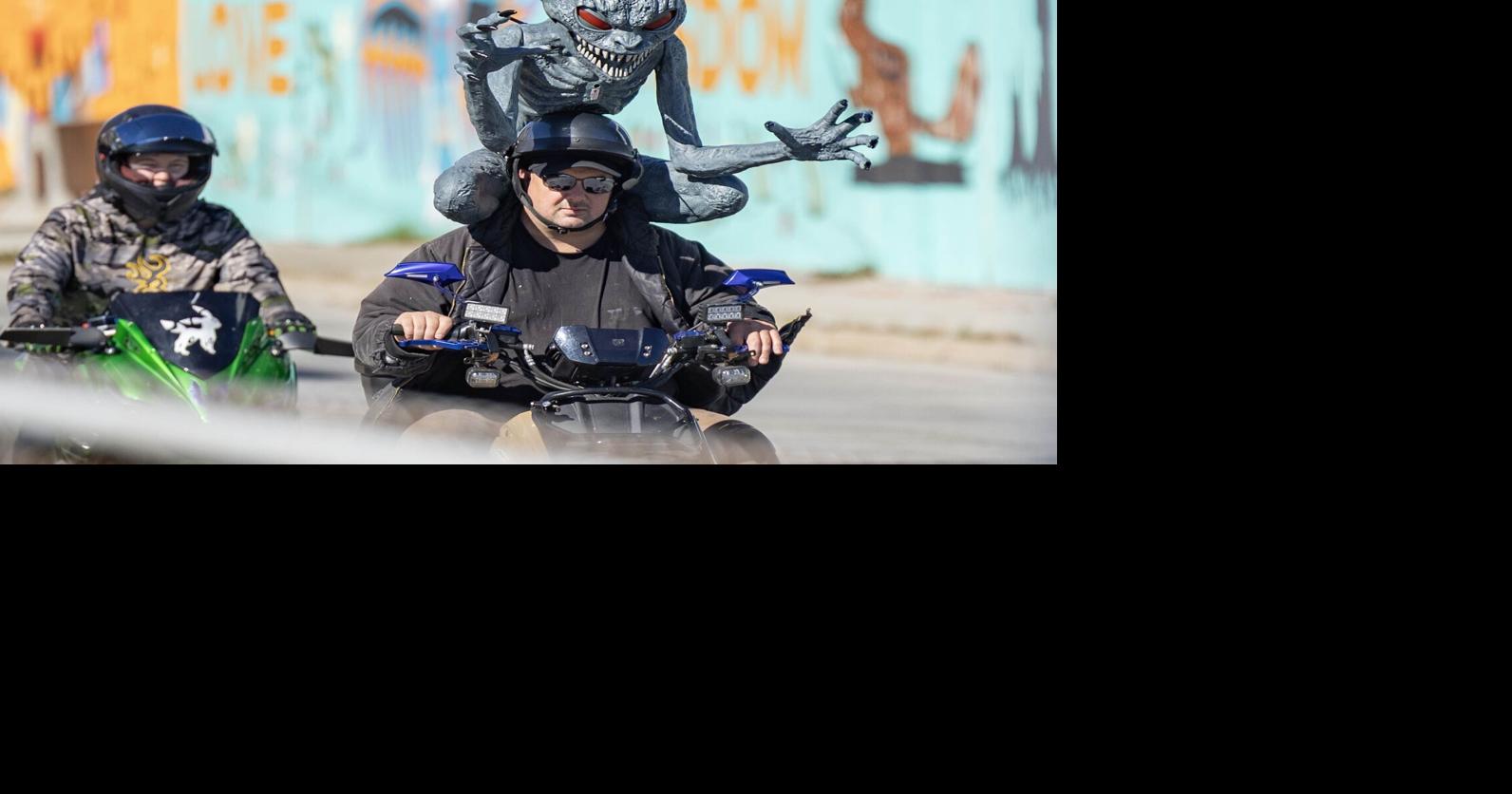 Photo: Gremlin hitches a ride on motorized scooter