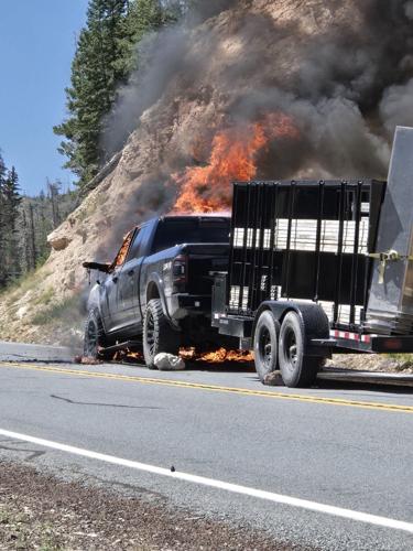 Pickup truck catches fire while pulling trailer on steep incline near ...