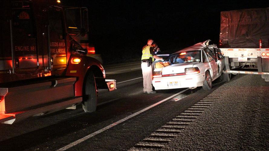 Injured driver taken to hospital after car rams into back of ...