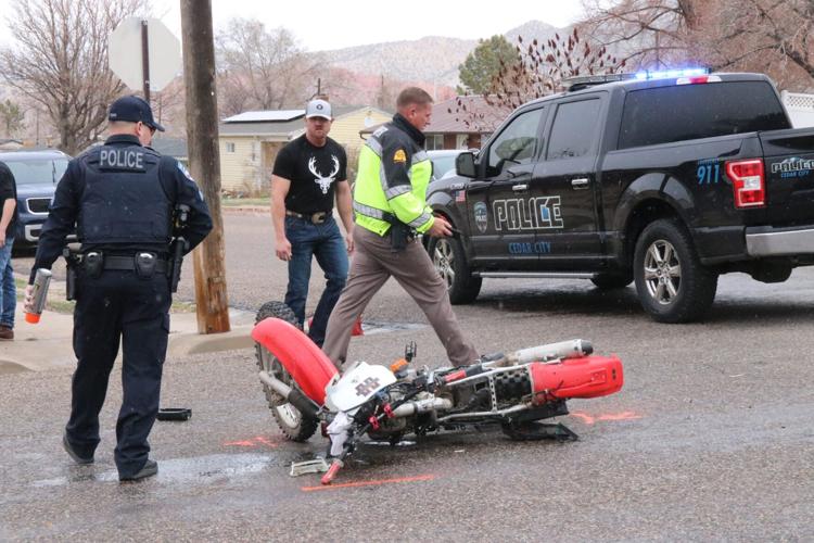 Police Motorcyclist reportedly ran stop sign, collided with car in
