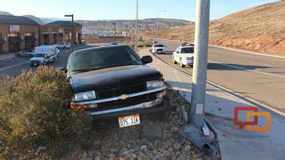 Driver arrested after crashing truck into light pole with child in the ...