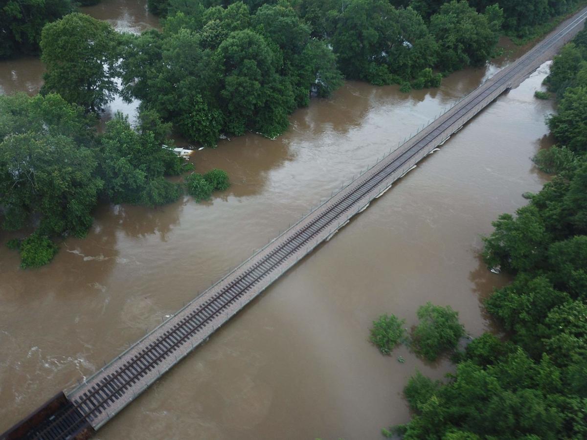 Historic flood surges through county News