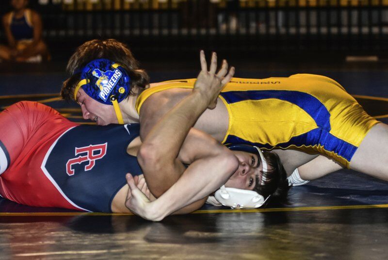 Stillwater wrestling rolls to blowout victory over rival Wildcats