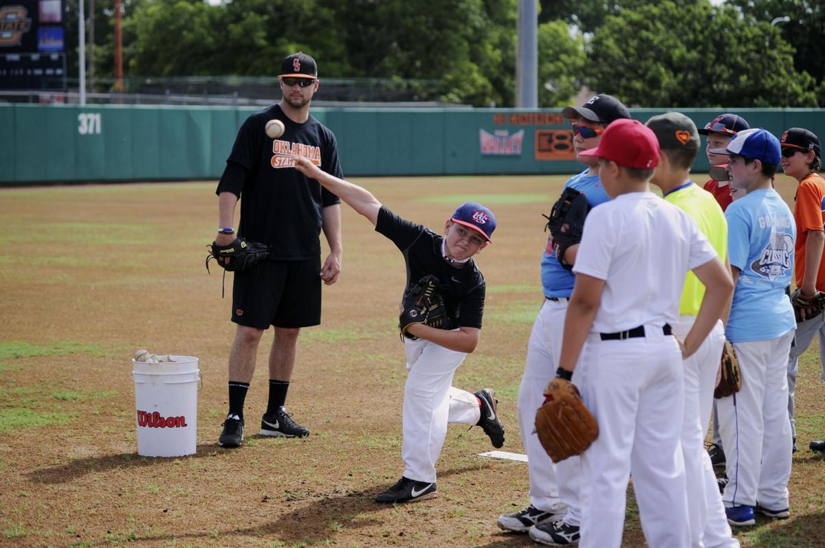 Young Cowboys participate in Josh Holliday baseball camp Sports