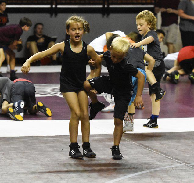 Cowboy camp growing sport of wrestling with youth, females ...