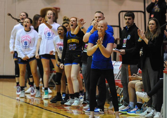 Stillwater High girls basketball coach, Kendrea Kilpatrick celebrates with team