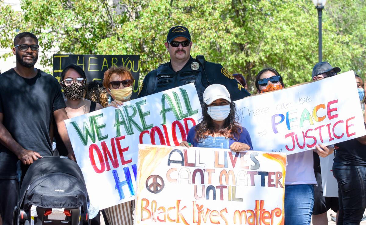 Officer with mass demonstrators.jpg
