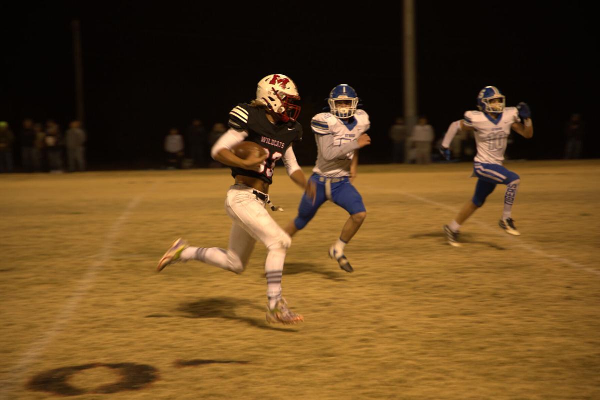 Senior Tyler Voss carries the football.jpg