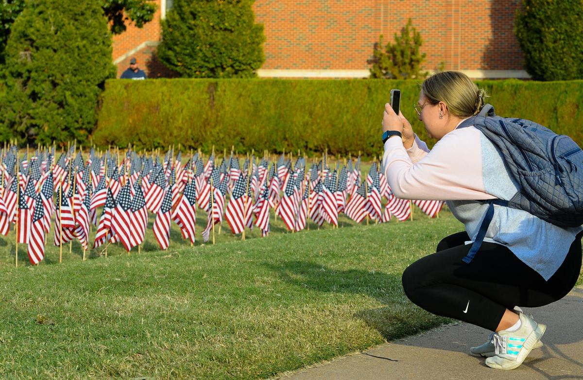 Student taking pic of flags.jpg