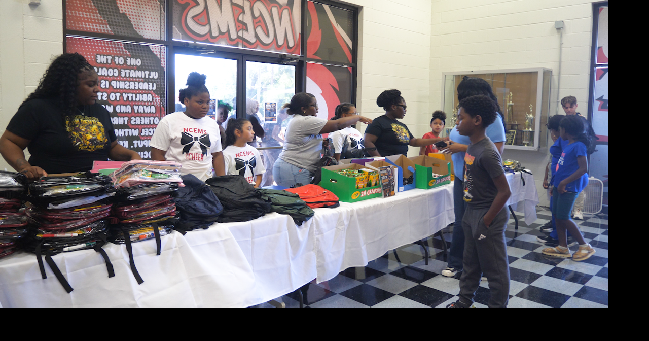Omarion Miller, Mikaylah Williams hold backpack giveaways